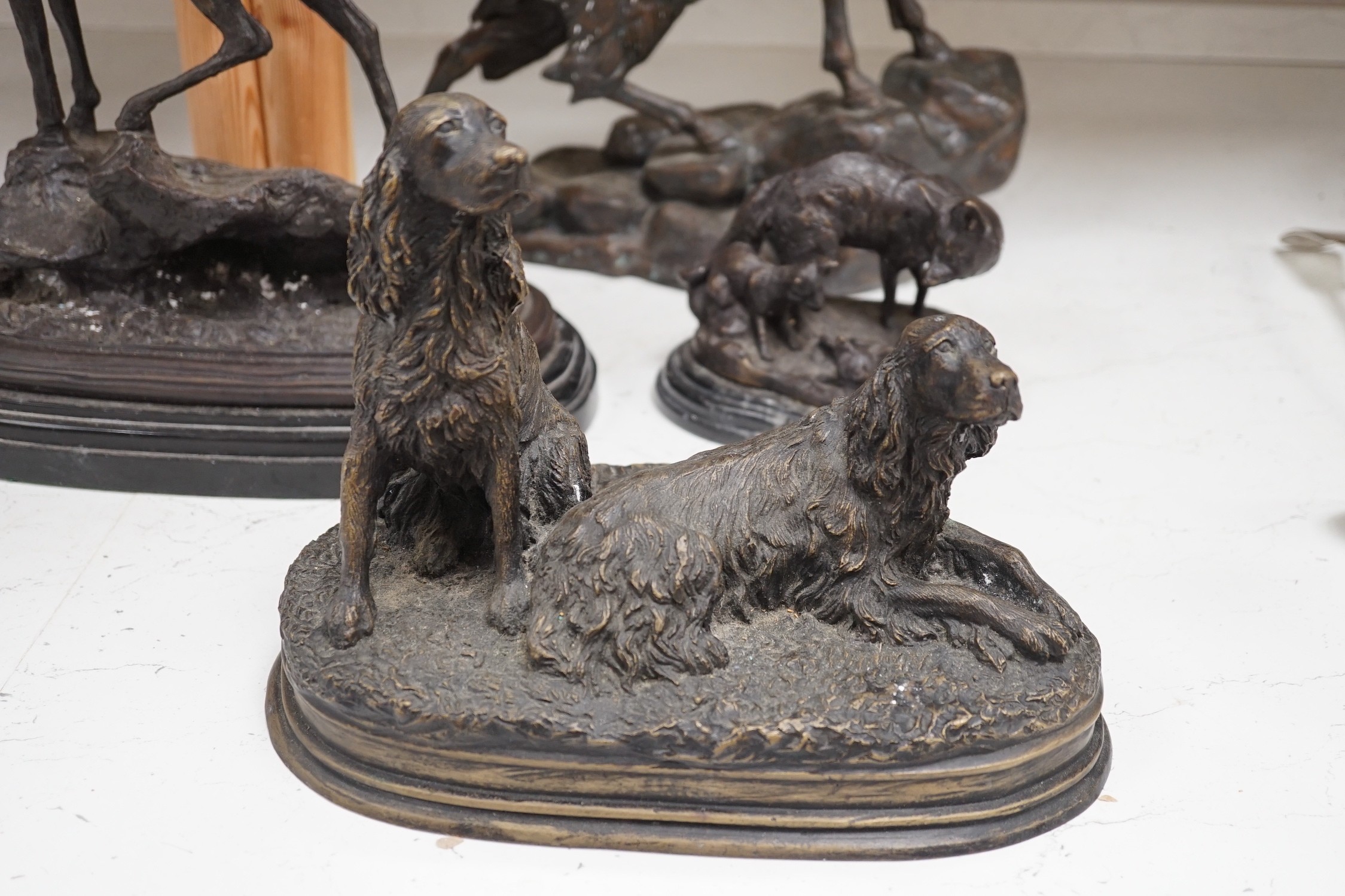 Four bronze animal groups, three foxes, a ram, a stag and two dogs, tallest stag 40.5 cms high